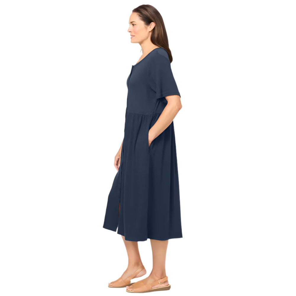 Woman wearing classic navy button-front dress with gathered waist and elbow sleeves