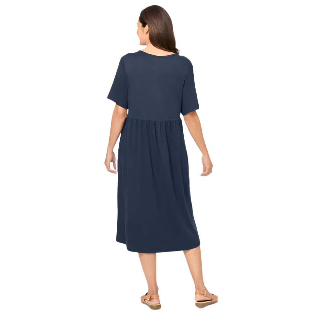 Woman wearing classic navy button-front dress with gathered waist and elbow sleeves