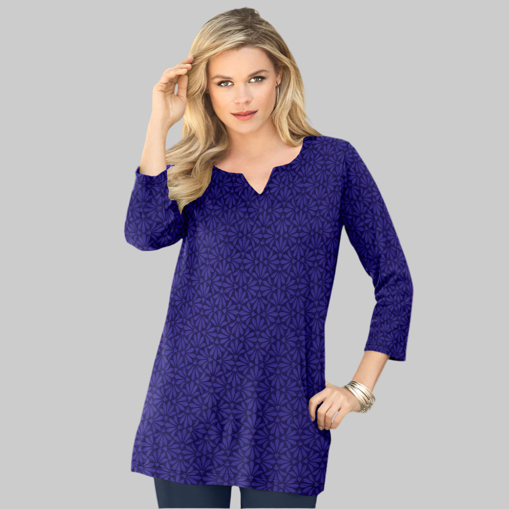 Plus-size soft knit tunic with a stitched notch neckline, three-quarter sleeves, side slits, and a relaxed fit. Made from a breathable cotton/poly blend.
