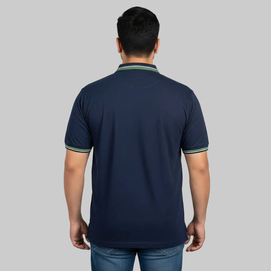 Navy plus size polo shirt with green tipped collar laid flat showing front view and contrast collar detail