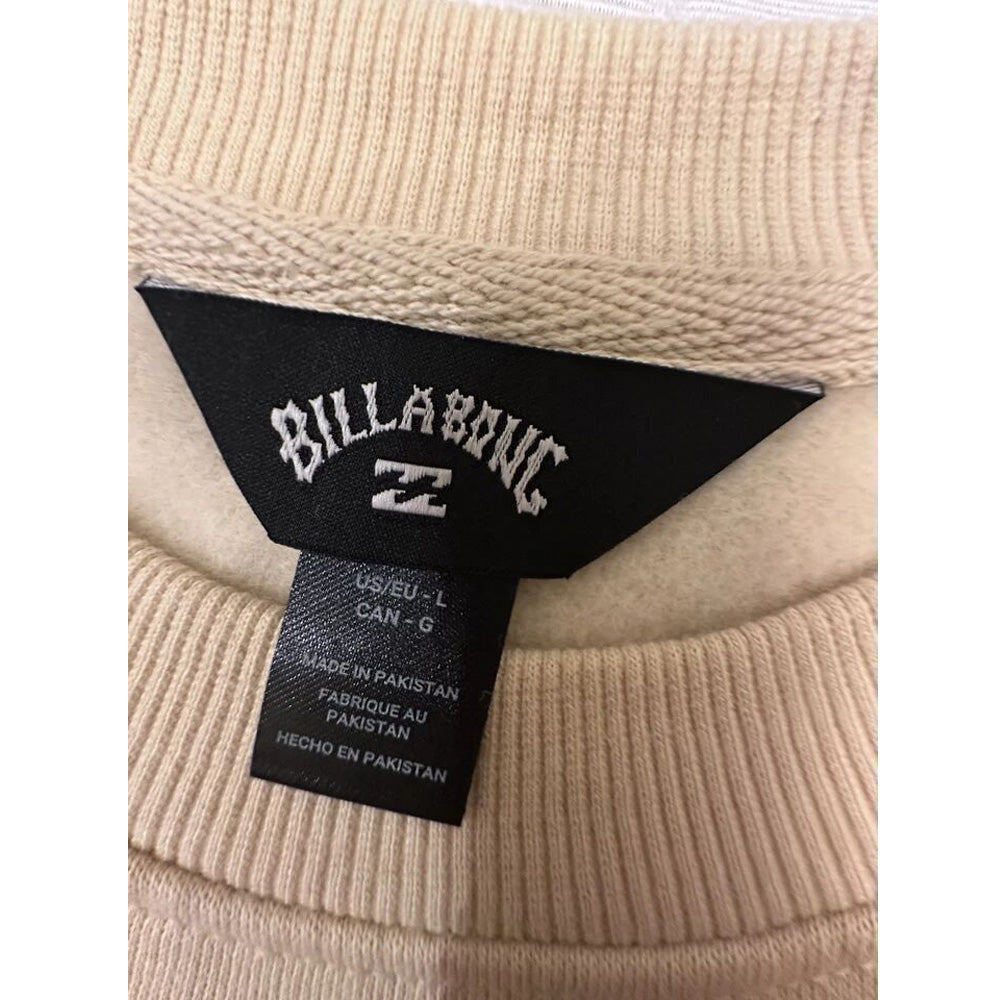 Close-up of fleece texture and ribbed crew neckline in oat tan sweatshirt