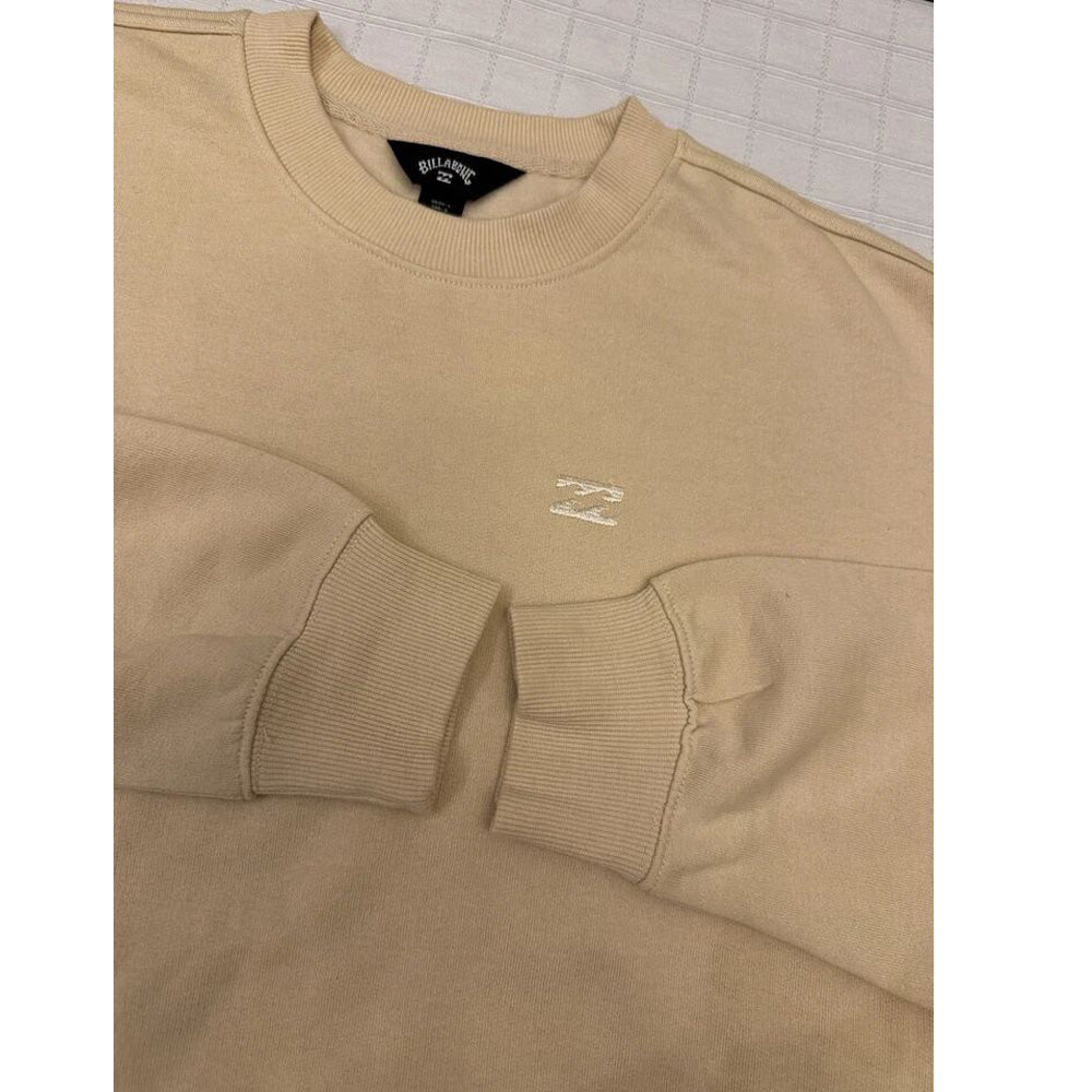 Close-up of fleece texture and ribbed crew neckline in oat tan sweatshirt