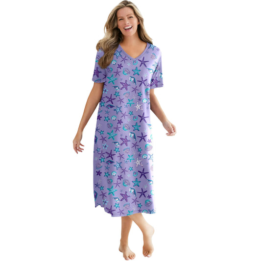Woman in a lavender starfish-print plus-size long sleepshirt with short sleeves and V-neck