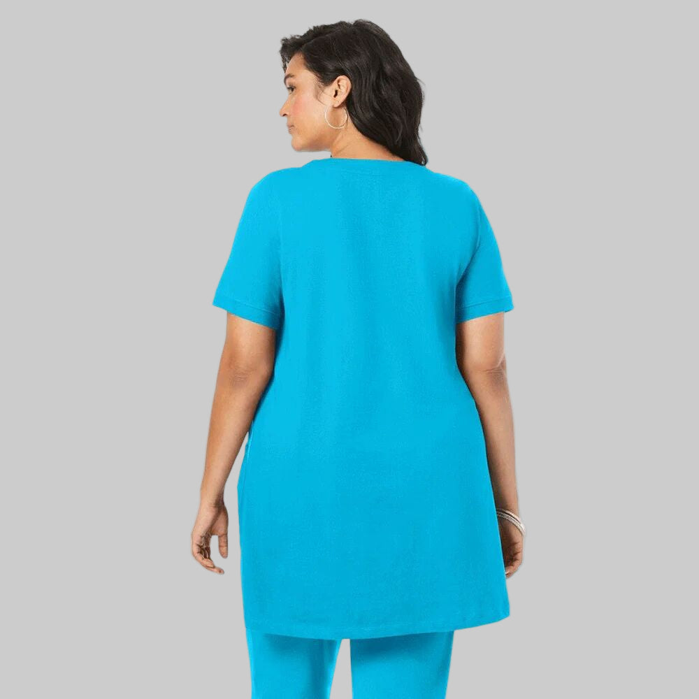 Ocean blue plus-size long-sleeve soft knit tunic with two pockets, a scoop neckline, and a relaxed fit for comfort and style.