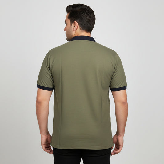 Alt Text: Men's olive green short-sleeve polo shirt featuring a contrast black collar and sleeve cuffs, laid flat on a light background.