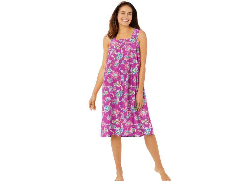 Plus-size sleeveless lounger featuring a paradise pink paisley print, square neckline, shirred yoke, elastic back, and side seam pockets.