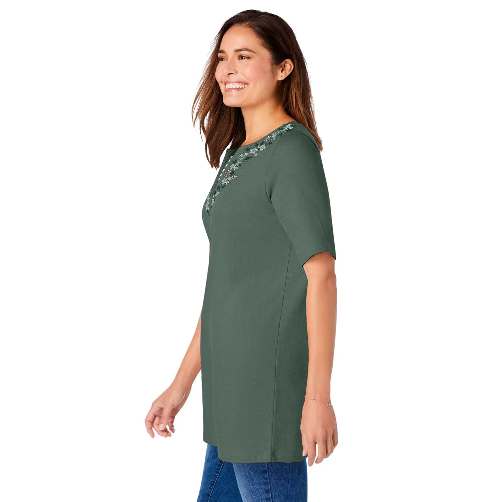 Plus-size 2-in-1 tunic with a notch neckline, striped contrast inset, and embroidered detail. Relaxed fit with elbow-length sleeves and a 30” tunic length.