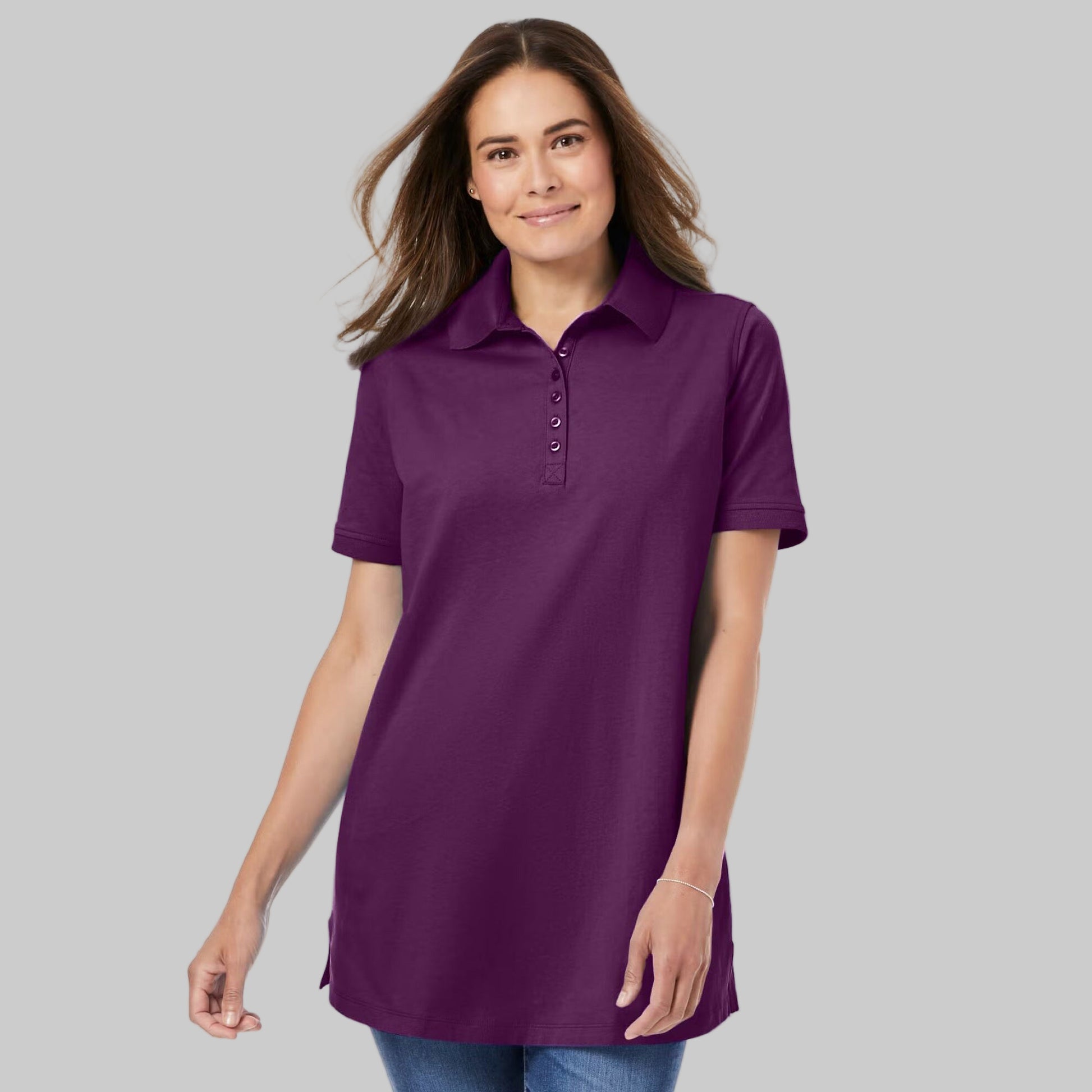 Plum purple plus-size short-sleeve polo shirt with a classic collar, relaxed fit, and 28-inch length made from soft cotton fabric.