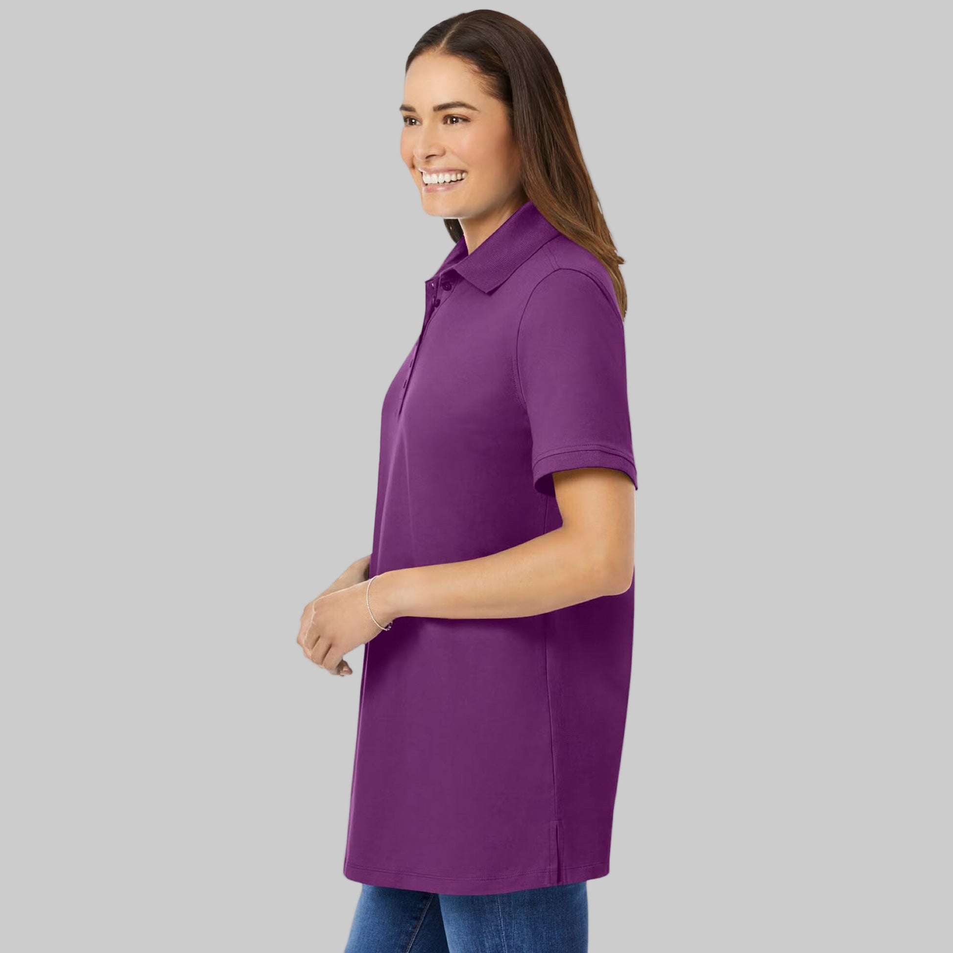 Plum purple plus-size short-sleeve polo shirt with a classic collar, relaxed fit, and 28-inch length made from soft cotton fabric.