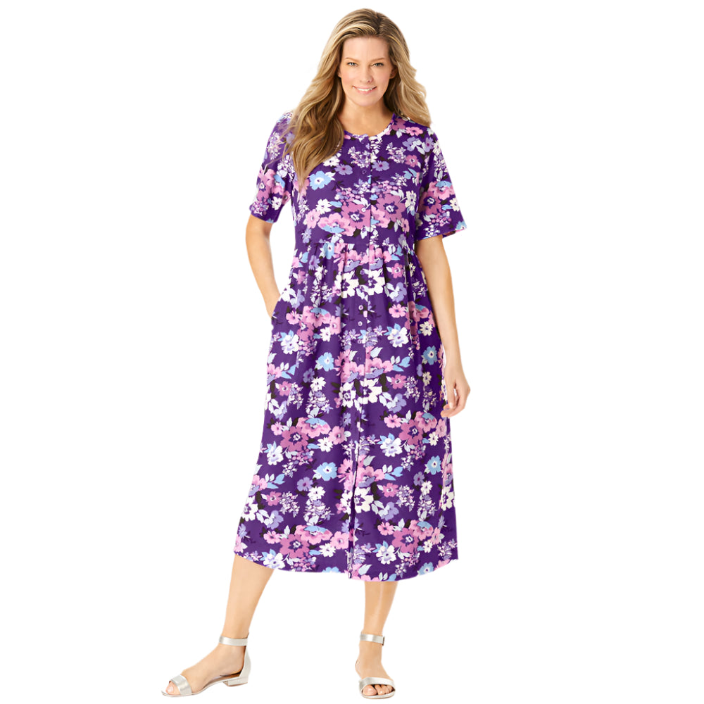 Woman wearing radiant purple garden print button-front dress with gathered waist and flowing skirt