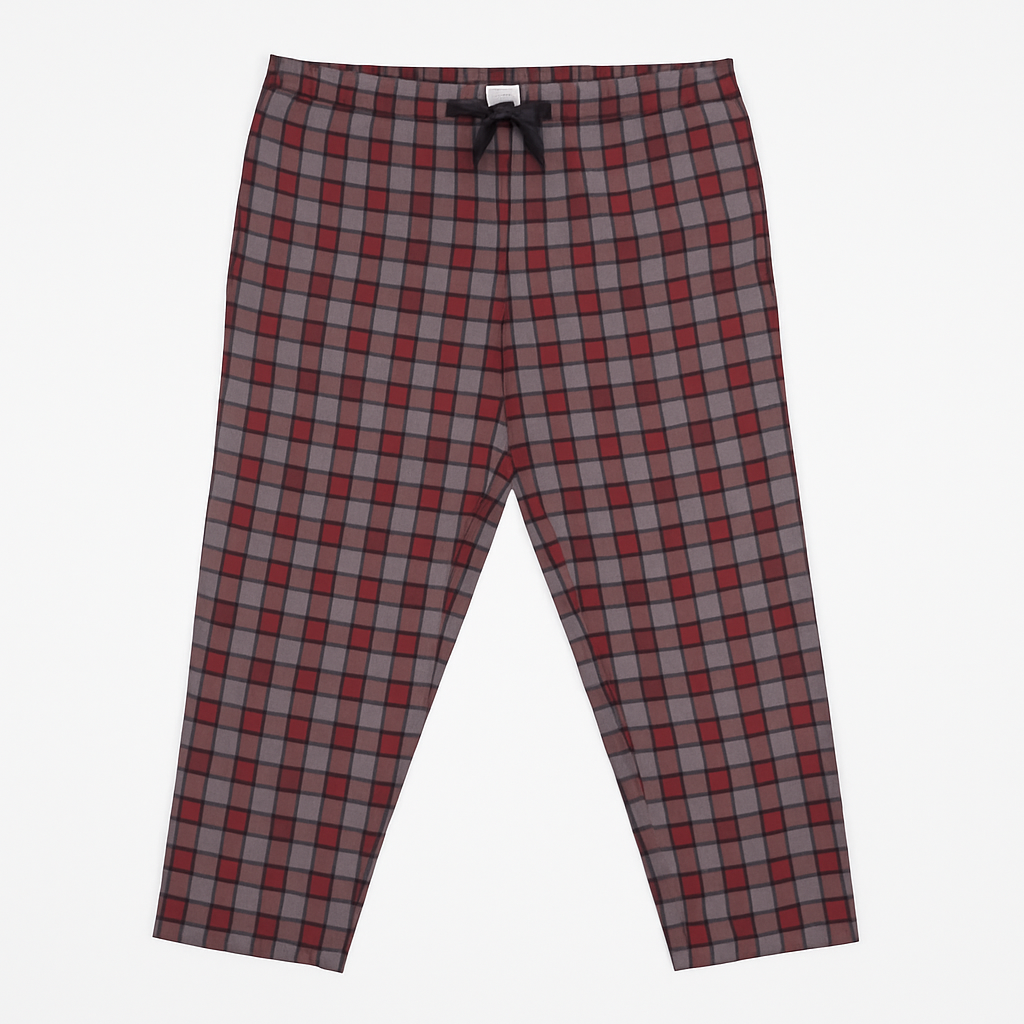 Red and grey plaid plus size lounge trousers with black drawstring, laid flat on a white background