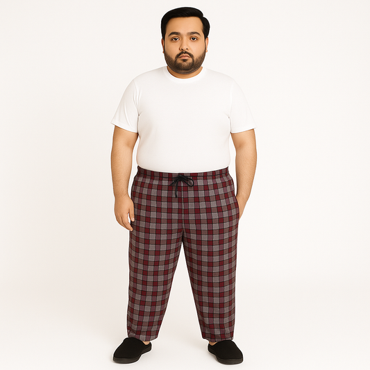 Red and grey plaid plus size lounge trousers with black drawstring, laid flat on a white background