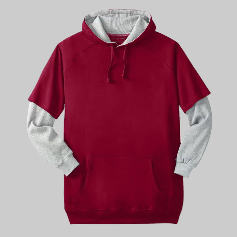 Rich burgundy thermal-lined layered look hoodie with contrast knit sleeves, drawstring hood, and front pouch pocket — casual winter fleece top.