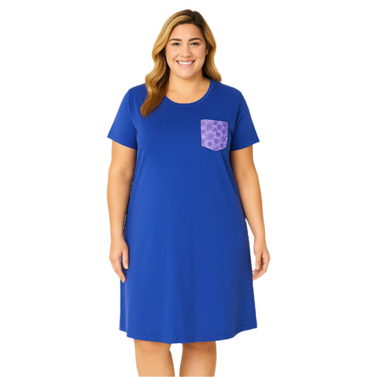 Plus-size woman wearing a royal blue lounge dress with short sleeves and a lavender floral pocket