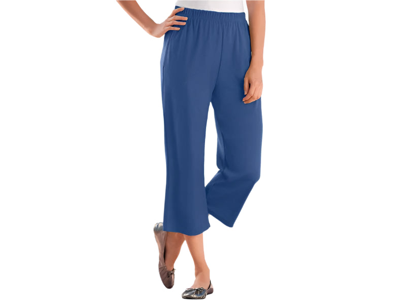 A woman wearing Royal Navy 7-Day Knit Capri Pants, designed with a relaxed fit, elastic waistband, and soft knit fabric for everyday comfort.