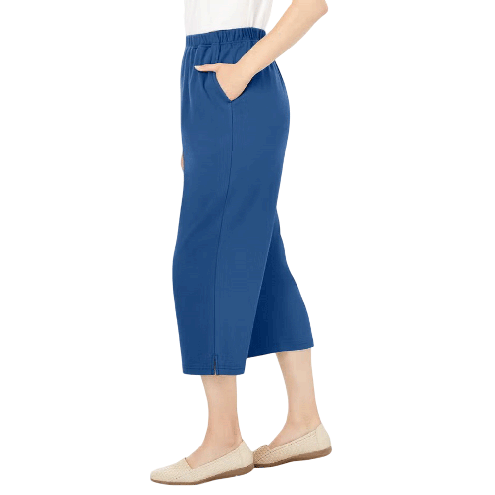 A woman wearing Royal Navy 7-Day Knit Capri Pants, designed with a relaxed fit, elastic waistband, and soft knit fabric for everyday comfort.