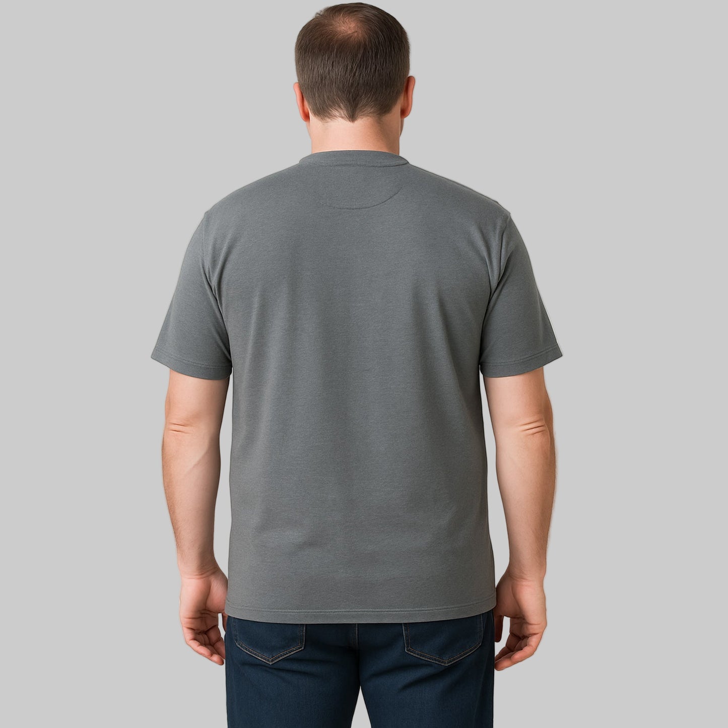 Plus-size Pakistani male model wearing steel short-sleeve Henley shirt on a clean studio background, relaxed fit.