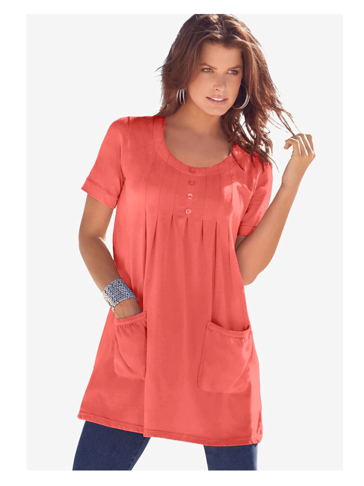 Sunset Coral Two Pocket Soft Knit Tunic with a scoop neckline, short sleeves, and functional pockets. Available in plus sizes 1X to 5X for a comfortable fit.