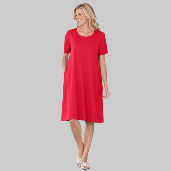 Plus size vivid red short sleeve crewneck tee dress with relaxed A-line silhouette in soft cotton poly jersey fabric for comfortable everyday wear.