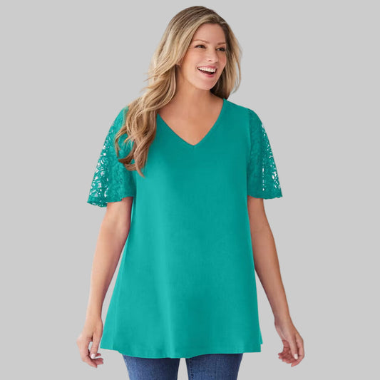 Plus-size tunic with lace flutter sleeves, a curved V-neckline, and a relaxed swingy fit. Made from a soft cotton/poly blend for comfort and style