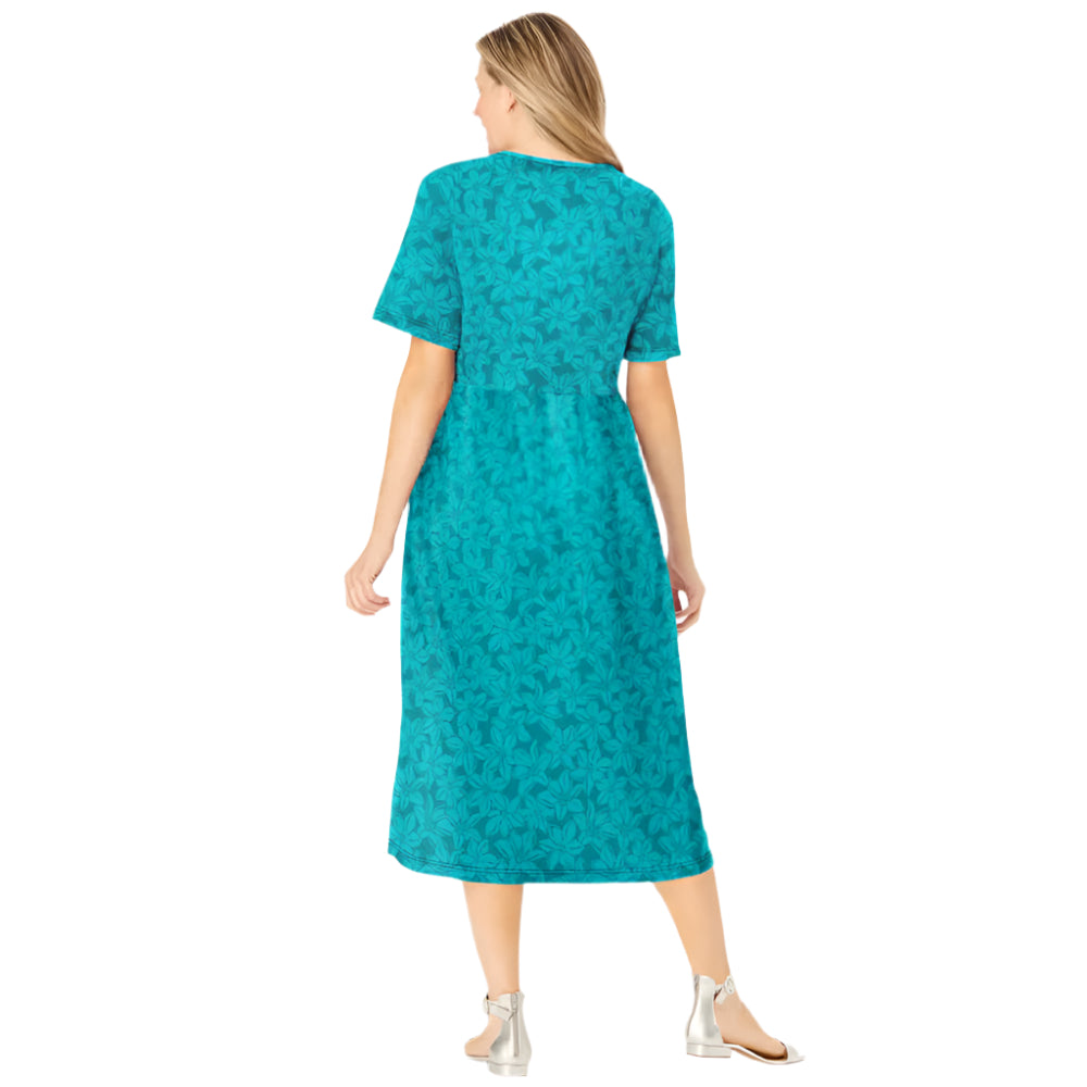 Woman wearing soft blue floral button-front dress with elbow sleeves and flowing skirt