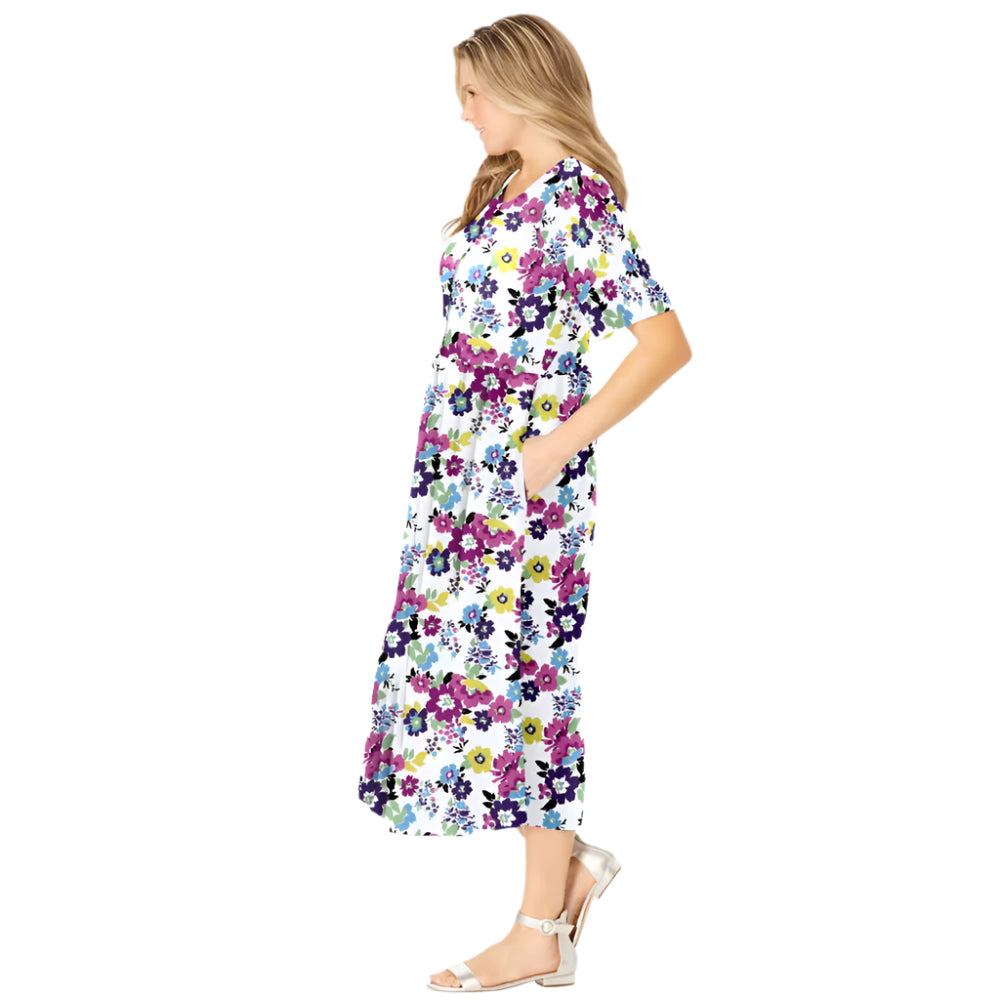 Woman wearing white floral garden print button-front dress with elbow sleeves and flowing skirt