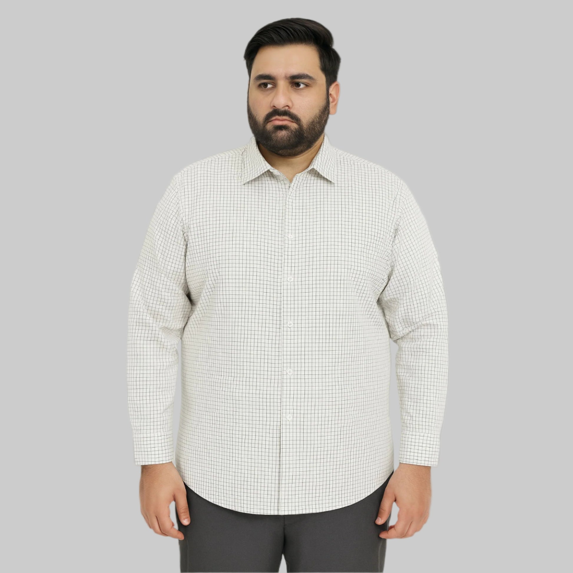 Plus-size Pakistani man wearing white shirt with small black grid check pattern