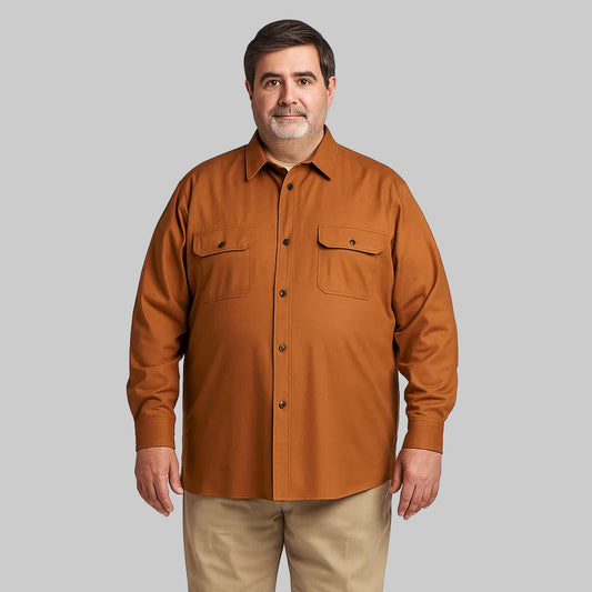 Plus-size man wearing a cedar brown flannel-lined twill shirt jacket with plaid inner lining, snap front, and flap chest pockets, photographed on a white studio background.