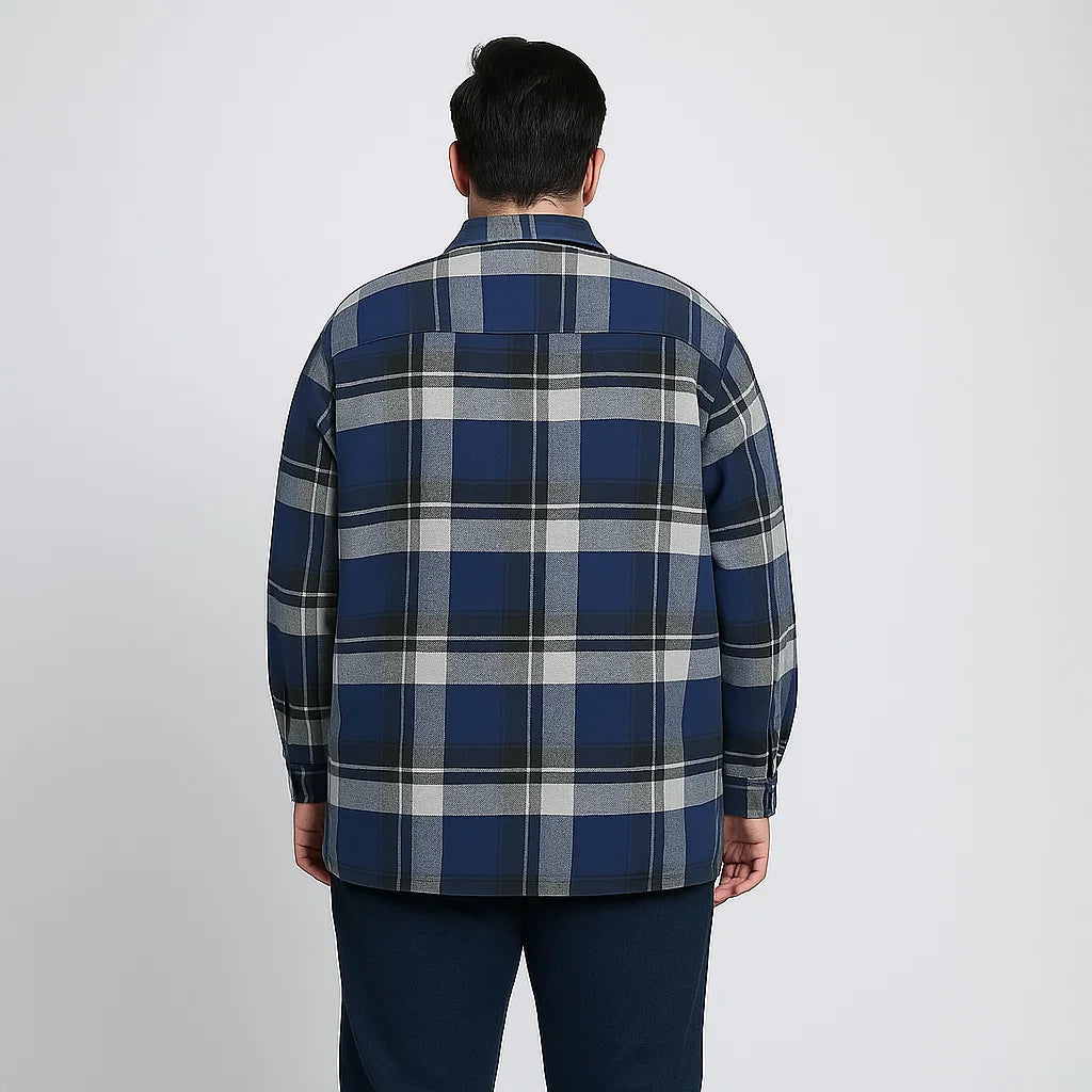 Navy plaid fleece-lined flannel shirt jacket for men with button front, chest pockets, and side pockets, displayed on a plain background.