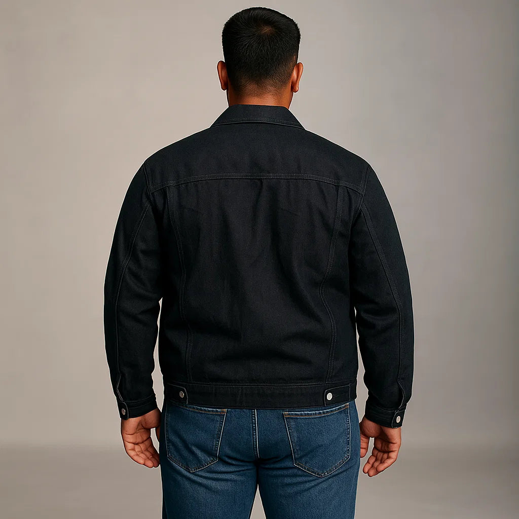 Man wearing black denim classic fit jacket with chest pockets and button-down front