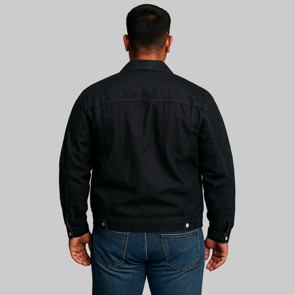 Man wearing black denim classic fit jacket with chest pockets and button-down front
