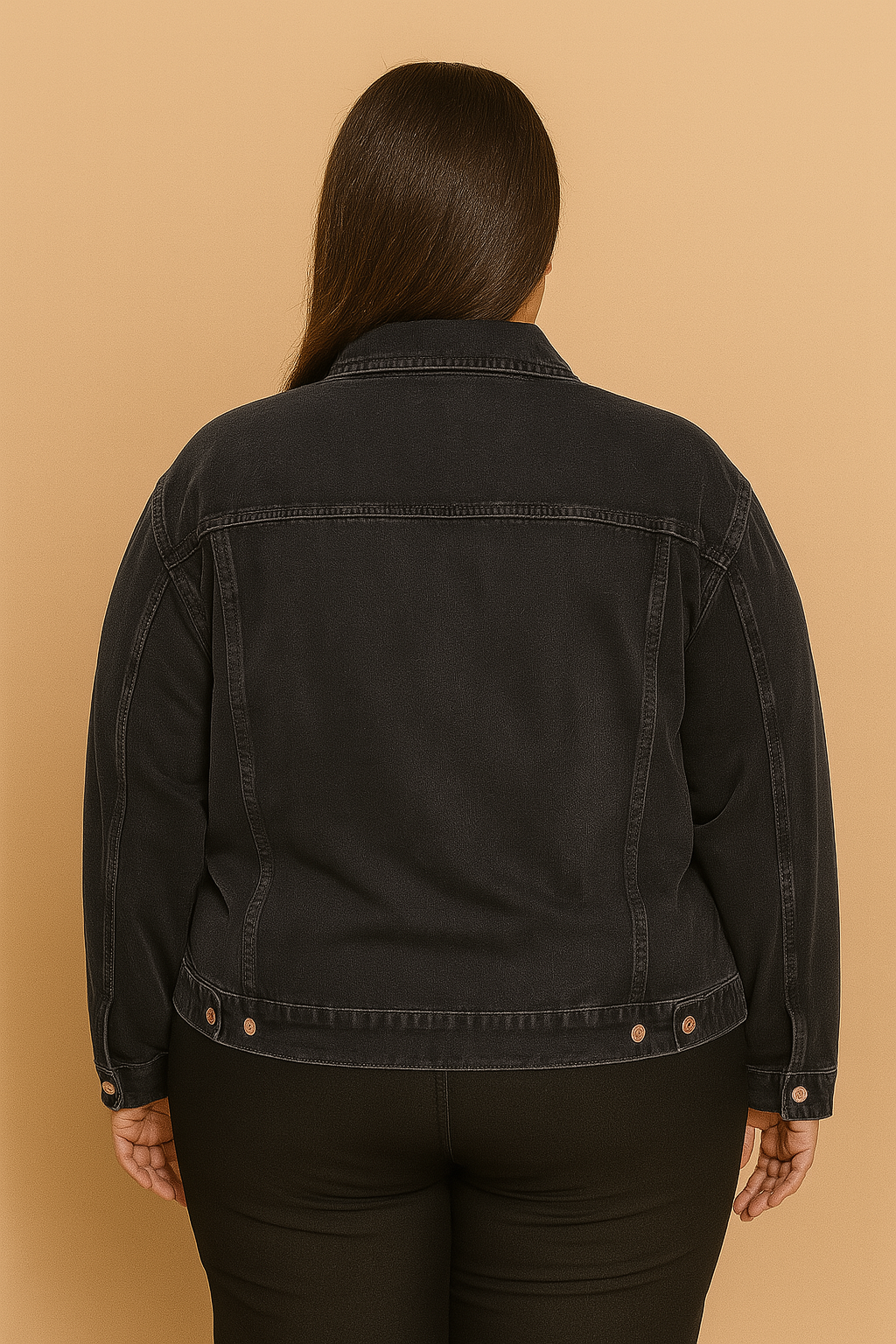 Plus-size woman wearing washed black denim jacket with button front and flap pockets
