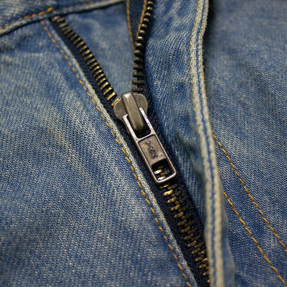 Plus-size men’s stone wash blue regular fit jeans with straight leg, button and zip fly, front and rear pockets, displayed on a clean white background.