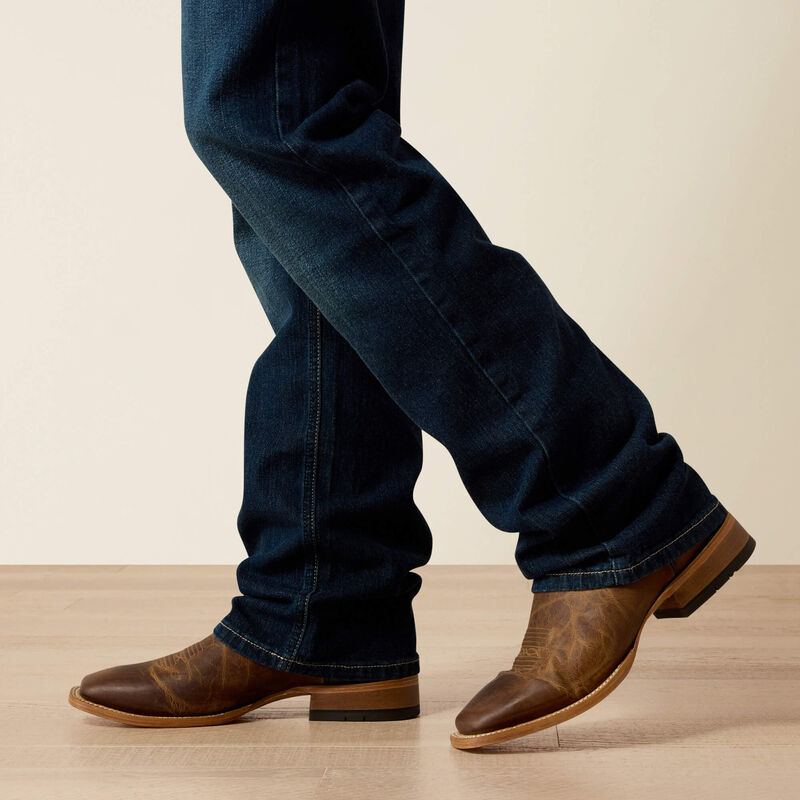 Indigo Slim Stretch Straight Leg Jean — stretch denim, straight through thigh, hand-sanded finish, zipper fly.