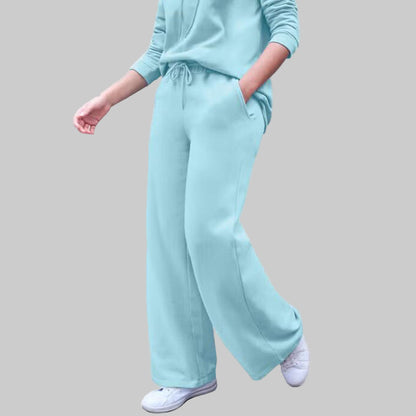 Plus-size Aqua Sky wide leg fleece sweatpants with drawstring waist and side pockets, displayed flat on a white background.