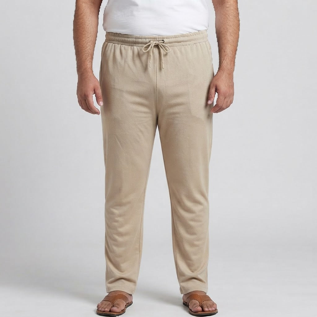 Beige elastic waist jersey cotton trousers for men, designed for comfortable everyday and casual wear.