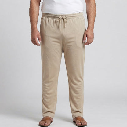 Beige elastic waist jersey cotton trousers for men, designed for comfortable everyday and casual wear.