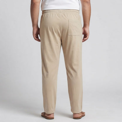 Beige elastic waist jersey cotton trousers for men, designed for comfortable everyday and casual wear.
