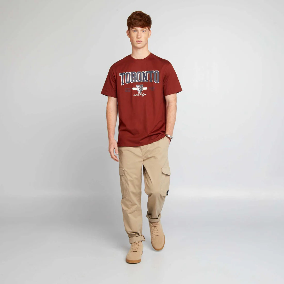 Men’s beige jogger pants with elasticated waist, side flap pockets, and elasticated ankles,