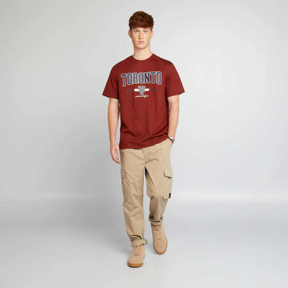 Men’s beige jogger pants with elasticated waist, side flap pockets, and elasticated ankles,