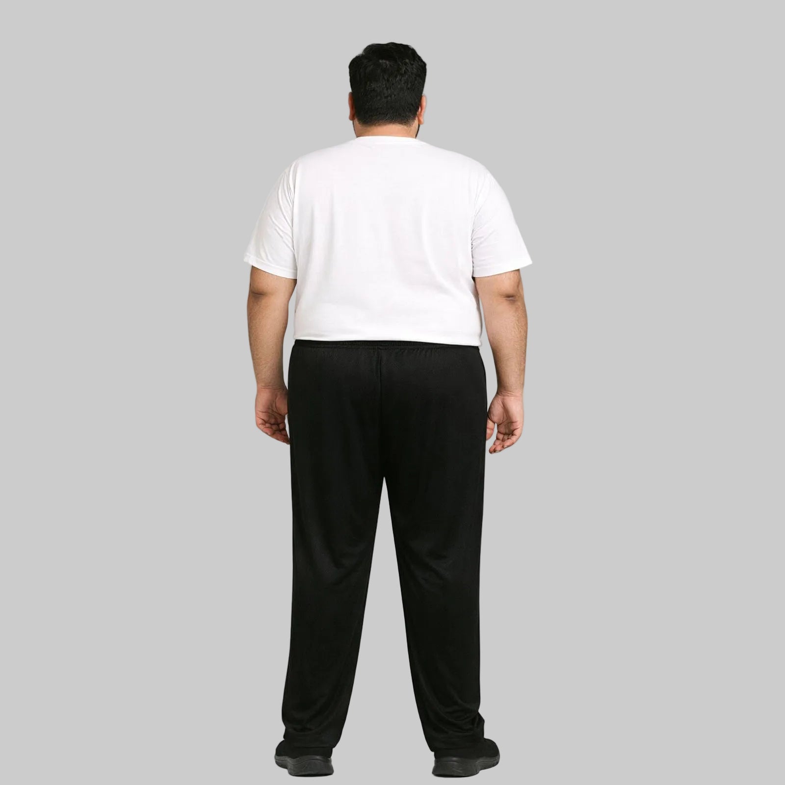 Black mesh polyester plus size trouser worn by a 2XL male model, featuring breathable fabric, elastic waistband, and a relaxed fit suitable for everyday wear