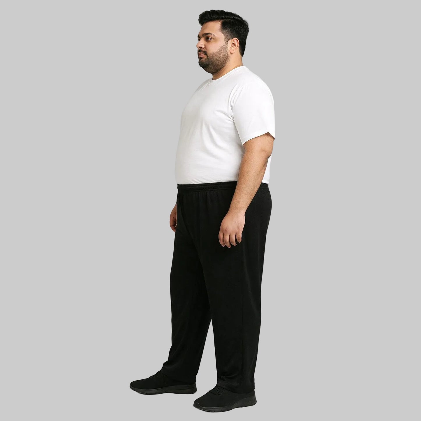 Black mesh polyester plus size trouser worn by a 2XL male model, featuring breathable fabric, elastic waistband, and a relaxed fit suitable for everyday wear
