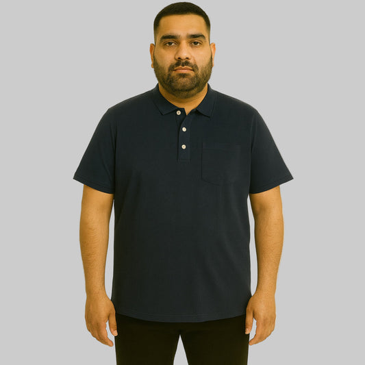 Plus-size Pakistani male model wearing black cotton polo shirt with horn buttons and chest pocket on a studio background.