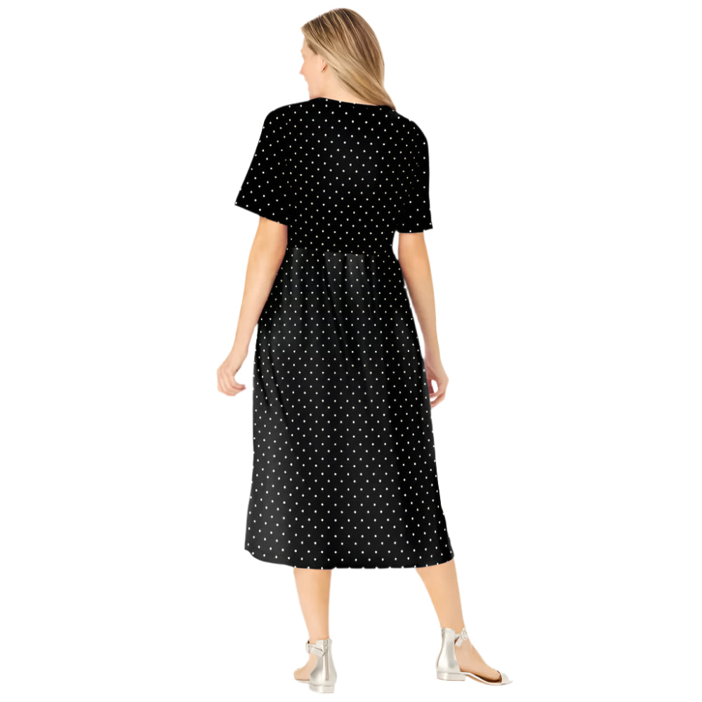 Woman wearing black polka dot button-front dress with gathered waist and flowing skirt