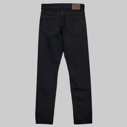 Men’s black slim fit stretch jeans with standard waist and slim leg, front studio view