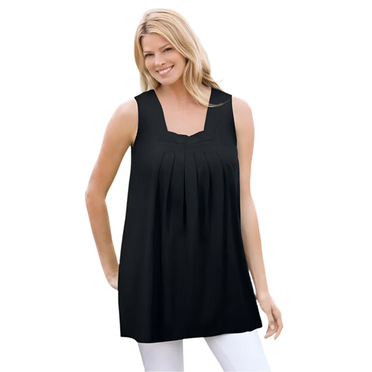 Woman wearing black swing tunic with square neckline, front pleats, and pockets
