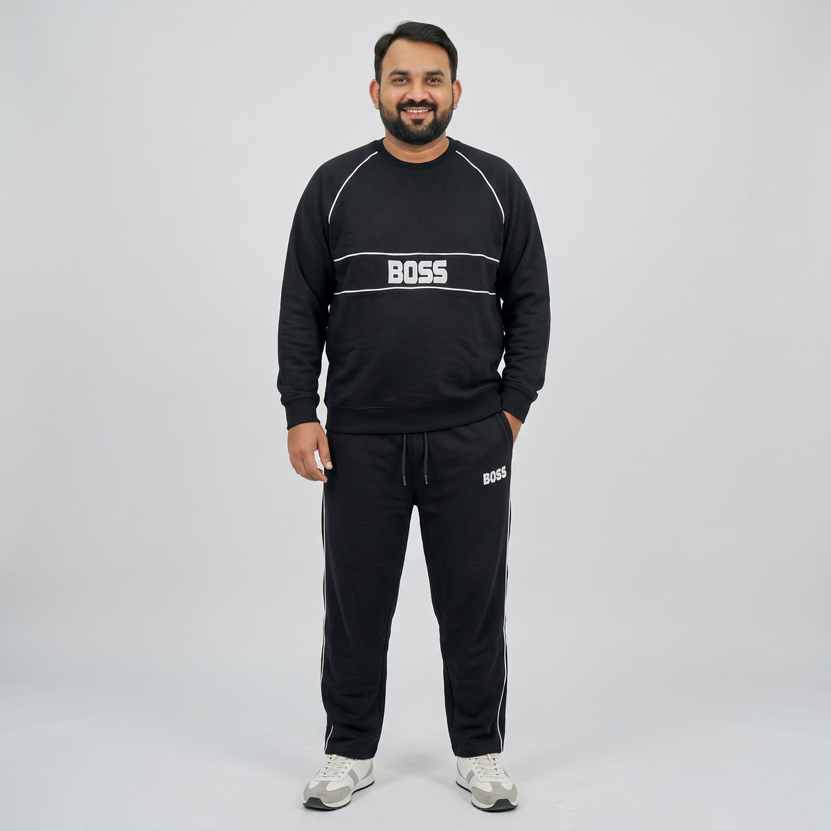 Black Embroidered Fleece Co-ord Set featuring a stylish embroidered top and matching trousers made from soft fleece fabric.