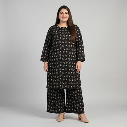 Woman wearing a black patterned outfit on a gray background