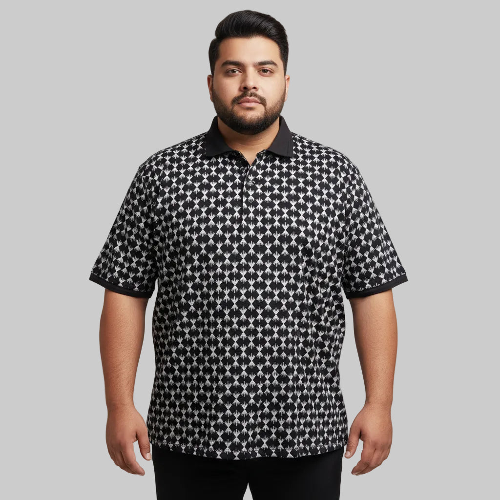 Black plus size polo shirt with white geometric print and solid black collar laid flat showing full front design