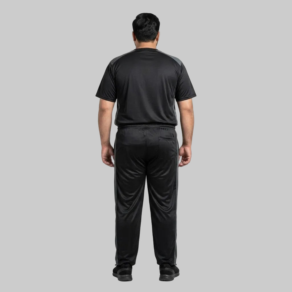 Men's Black & Grey Polyester Co-Ord Set featuring a crewneck T-shirt and matching trousers made from breathable mesh polyester fabric with grey contrast panels.